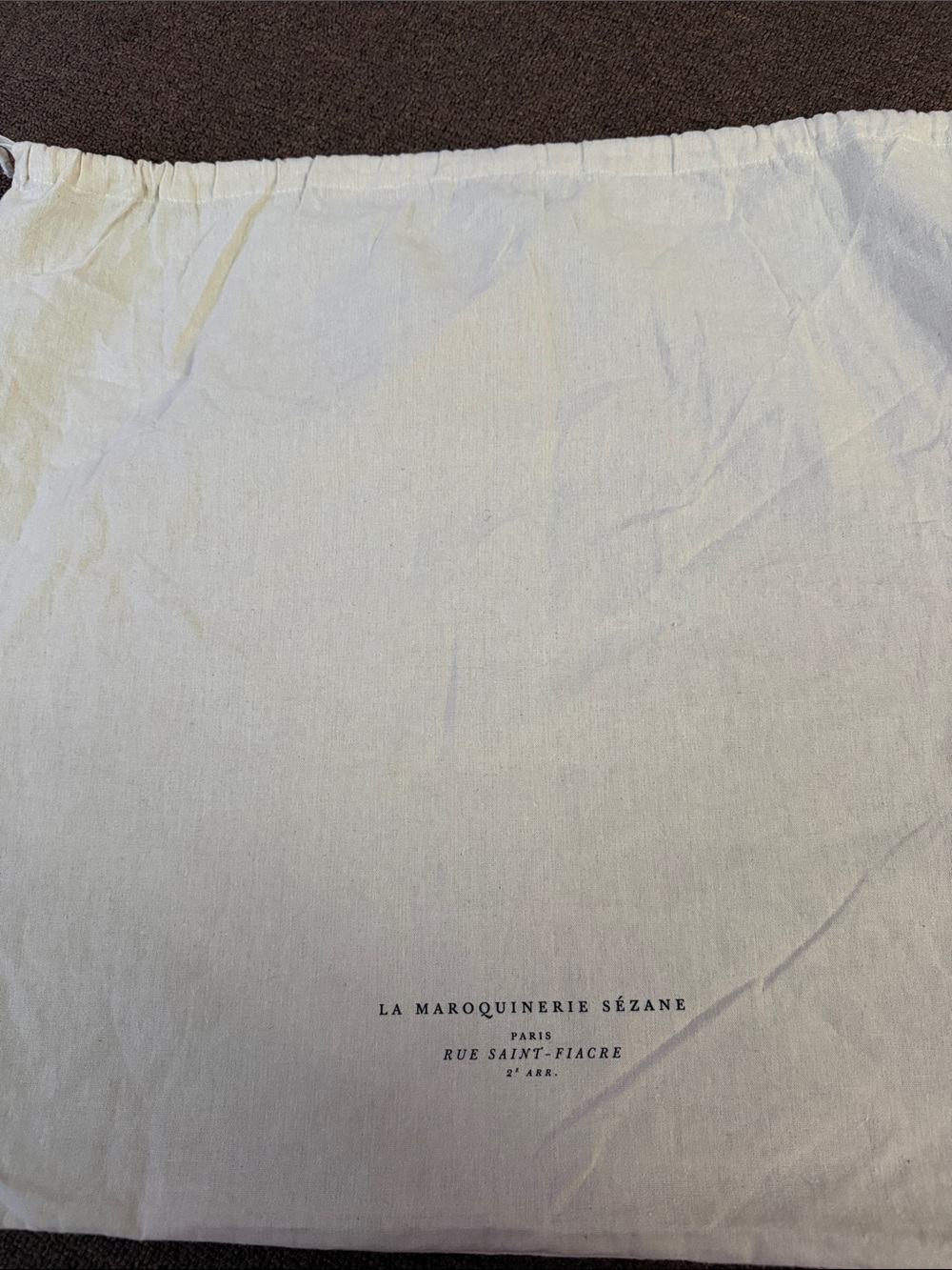 La Maroquinerie Paris Cotton Dust Bag in Cream